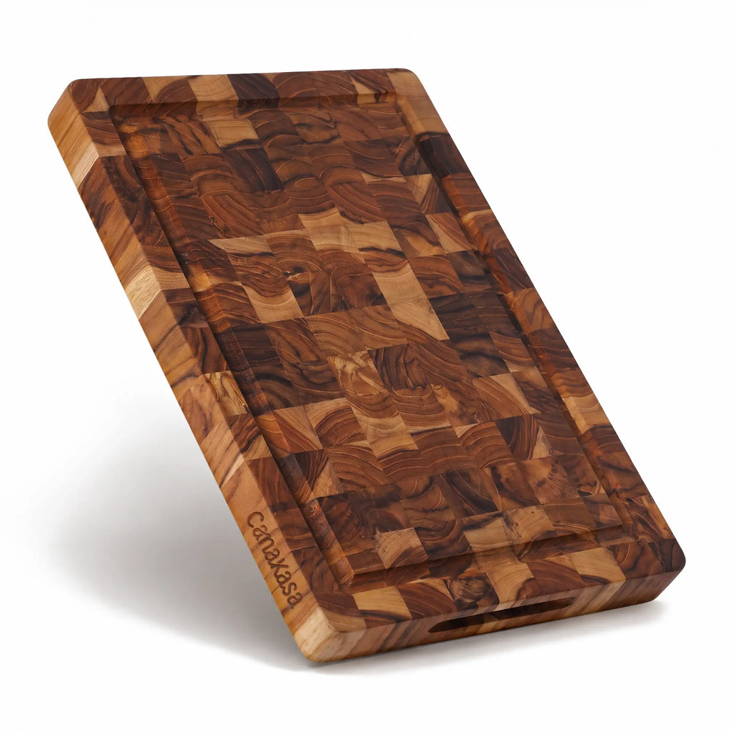 Small teak wood cutting board with juice groove and handles